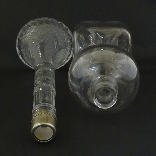 230 - Two decanters, one with Russian silver collar, the other with pinch detail. The tallest approx 13