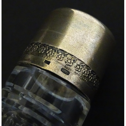 230 - Two decanters, one with Russian silver collar, the other with pinch detail. The tallest approx 13