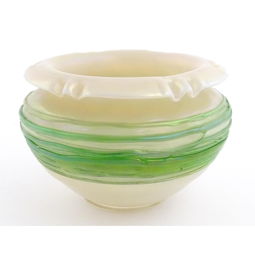 236 - A Bohemian Art Nouveau style glass bowl, the iridescent body with green trailed detail. Approx 3 3/4... 