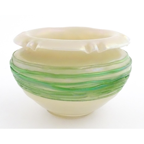 236 - A Bohemian Art Nouveau style glass bowl, the iridescent body with green trailed detail. Approx 3 3/4... 