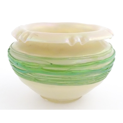 236 - A Bohemian Art Nouveau style glass bowl, the iridescent body with green trailed detail. Approx 3 3/4... 