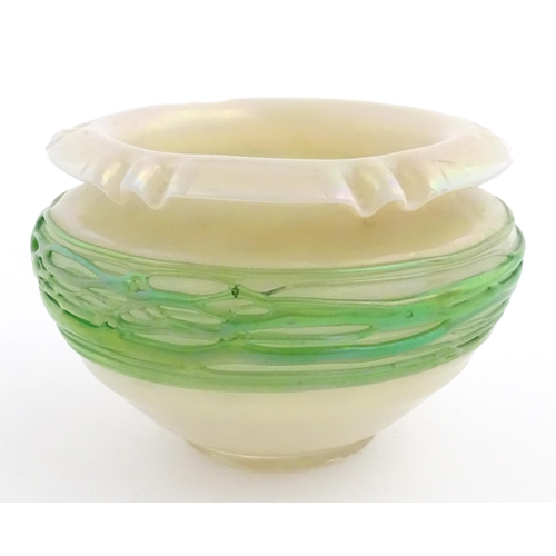 236 - A Bohemian Art Nouveau style glass bowl, the iridescent body with green trailed detail. Approx 3 3/4... 