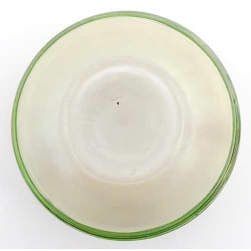 236 - A Bohemian Art Nouveau style glass bowl, the iridescent body with green trailed detail. Approx 3 3/4... 
