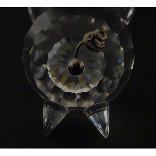 304 - Four Swarovski crystal models of pigs. Largest approx. 2 3/4