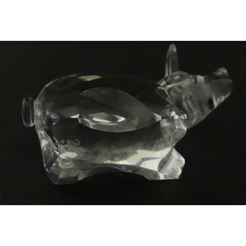 304 - Four Swarovski crystal models of pigs. Largest approx. 2 3/4