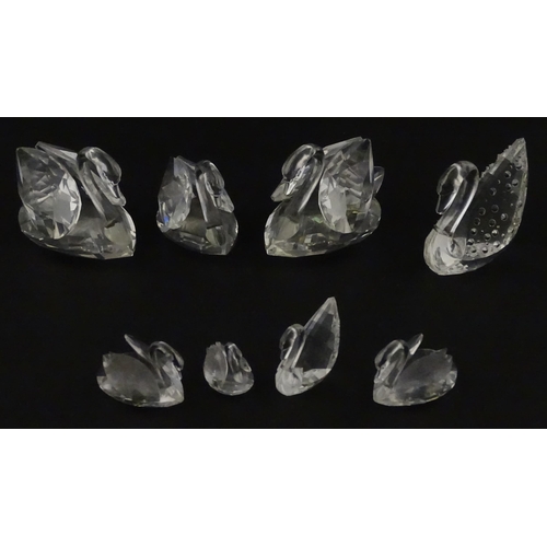 305 - Eight Swarovski crystal models of swans. Largest approx. 2 3/4