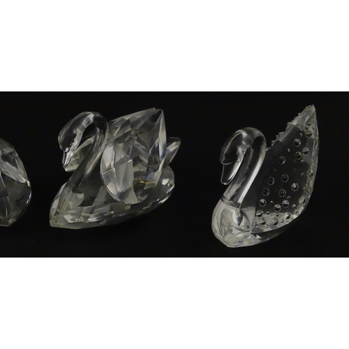 305 - Eight Swarovski crystal models of swans. Largest approx. 2 3/4
