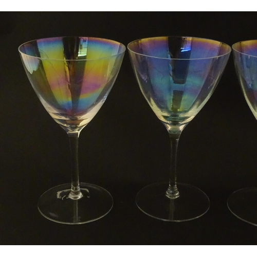 311 - Fifteen iridescent glass wine glasses. Largest approx. 7