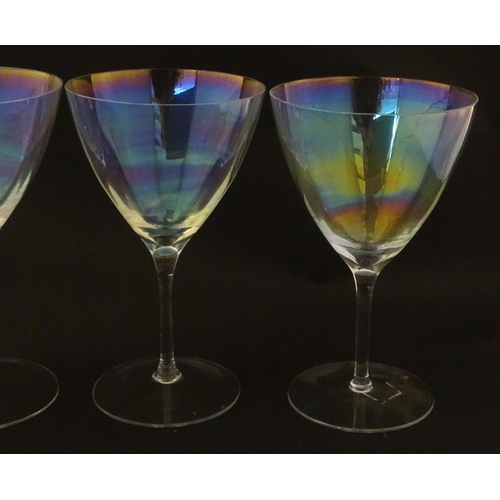 311 - Fifteen iridescent glass wine glasses. Largest approx. 7