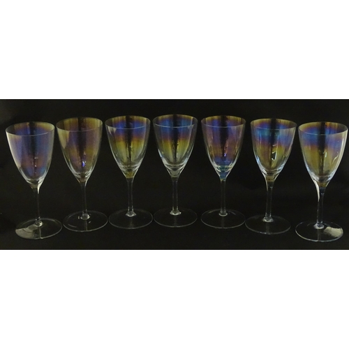 311 - Fifteen iridescent glass wine glasses. Largest approx. 7
