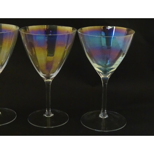 311 - Fifteen iridescent glass wine glasses. Largest approx. 7