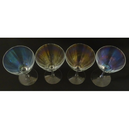 311 - Fifteen iridescent glass wine glasses. Largest approx. 7