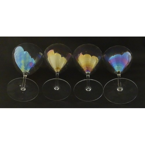 311 - Fifteen iridescent glass wine glasses. Largest approx. 7
