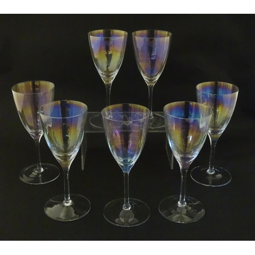 311 - Fifteen iridescent glass wine glasses. Largest approx. 7