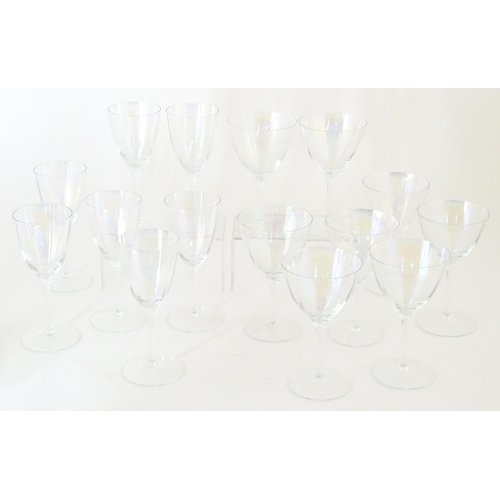 311 - Fifteen iridescent glass wine glasses. Largest approx. 7