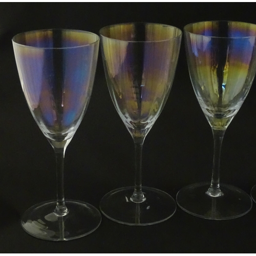 311 - Fifteen iridescent glass wine glasses. Largest approx. 7
