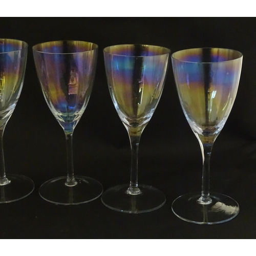 311 - Fifteen iridescent glass wine glasses. Largest approx. 7