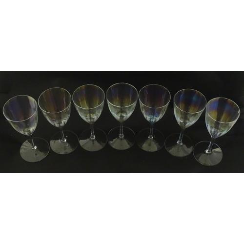 311 - Fifteen iridescent glass wine glasses. Largest approx. 7