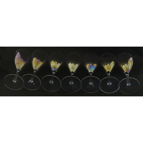 311 - Fifteen iridescent glass wine glasses. Largest approx. 7