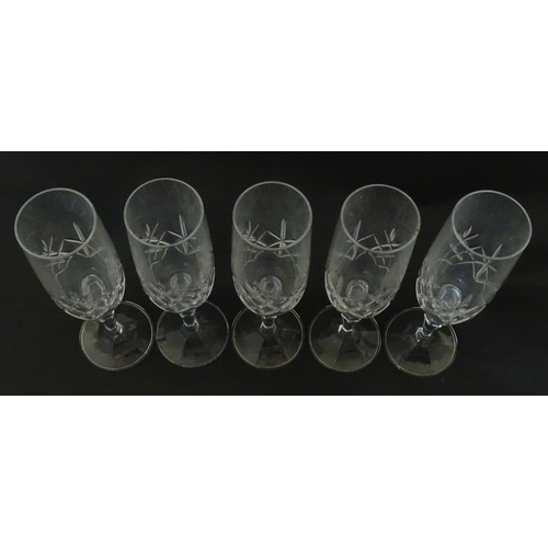312 - Eleven cut glass champagne flutes. Approx. 8 1/2