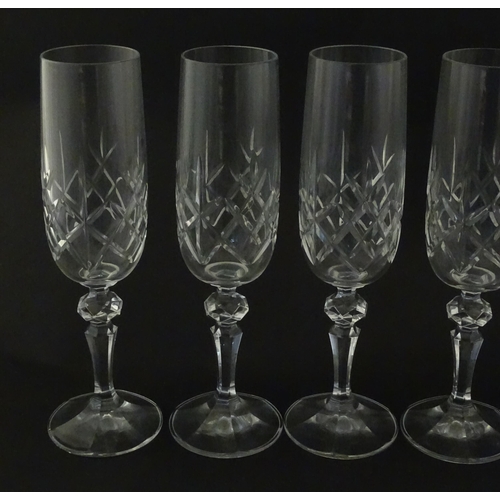 312 - Eleven cut glass champagne flutes. Approx. 8 1/2