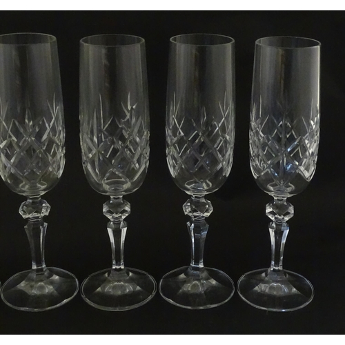 312 - Eleven cut glass champagne flutes. Approx. 8 1/2
