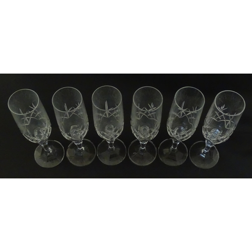 312 - Eleven cut glass champagne flutes. Approx. 8 1/2
