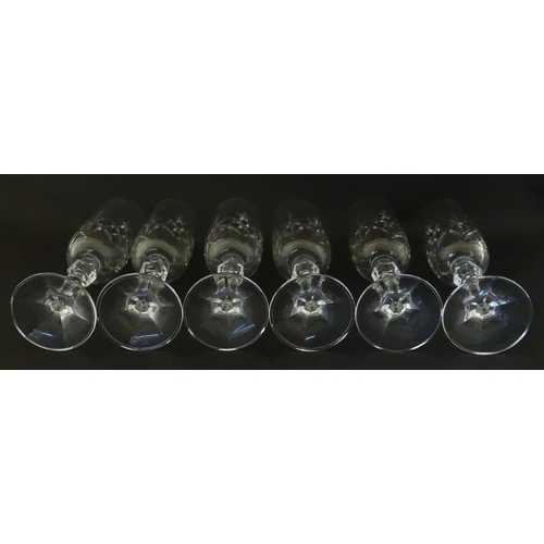 312 - Eleven cut glass champagne flutes. Approx. 8 1/2