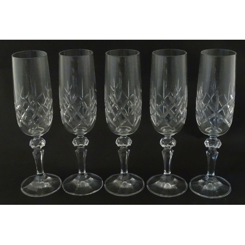 312 - Eleven cut glass champagne flutes. Approx. 8 1/2