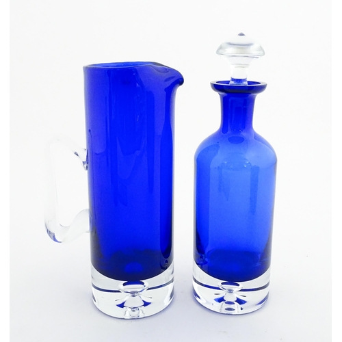 314 - Two Polish Krosno blue glass items comprising a lemonade / water jug, and a decanter. Decanter appro... 
