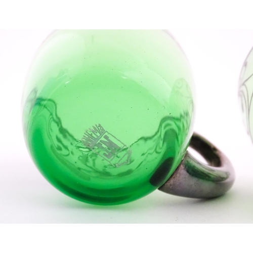 315 - A Spanish green glass punch bowl with ladle and six punch cups with silvered overlay detail. Marked ... 