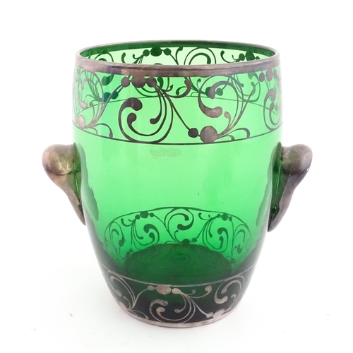 315 - A Spanish green glass punch bowl with ladle and six punch cups with silvered overlay detail. Marked ... 