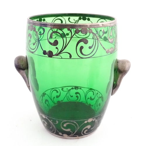 315 - A Spanish green glass punch bowl with ladle and six punch cups with silvered overlay detail. Marked ... 