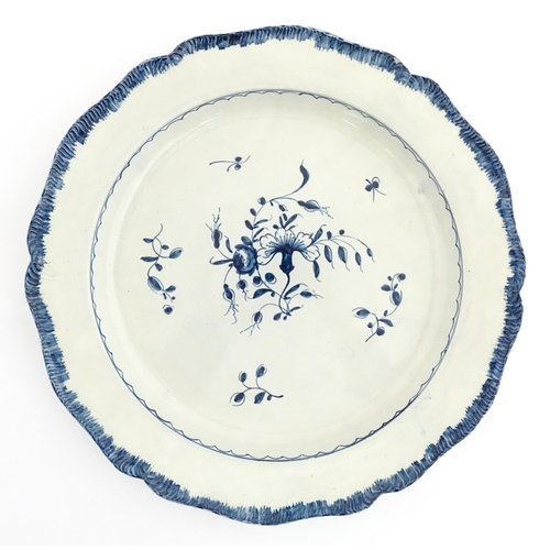 187 - A blue and white pearlware feathered edge charger with floral and foliate brushwork detail. Approx. ... 