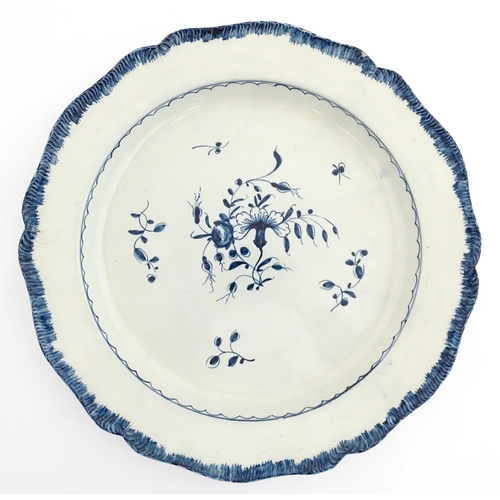 187 - A blue and white pearlware feathered edge charger with floral and foliate brushwork detail. Approx. ... 