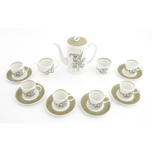 206 - A Susie Cooper coffee set decorated in the Iris pattern comprising coffee pot, sugar bowl, milk jug,... 