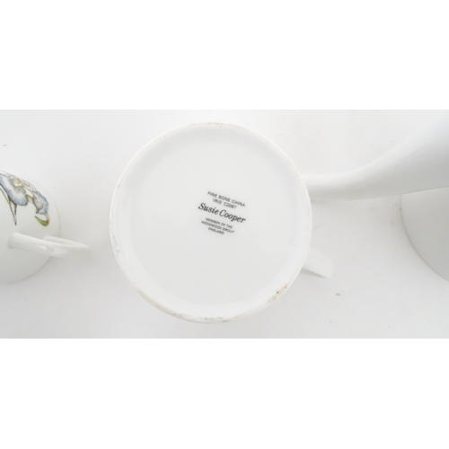 206 - A Susie Cooper coffee set decorated in the Iris pattern comprising coffee pot, sugar bowl, milk jug,... 