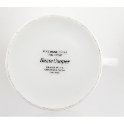 206 - A Susie Cooper coffee set decorated in the Iris pattern comprising coffee pot, sugar bowl, milk jug,... 