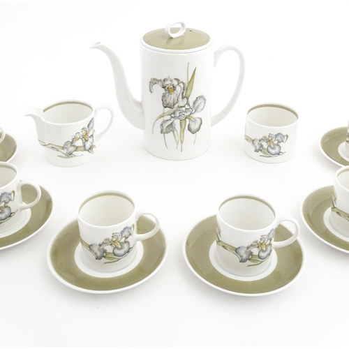 206 - A Susie Cooper coffee set decorated in the Iris pattern comprising coffee pot, sugar bowl, milk jug,... 