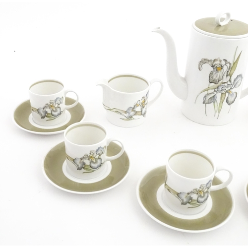 206 - A Susie Cooper coffee set decorated in the Iris pattern comprising coffee pot, sugar bowl, milk jug,... 