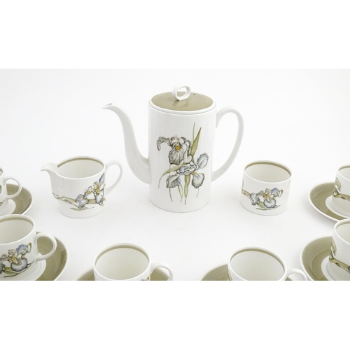 206 - A Susie Cooper coffee set decorated in the Iris pattern comprising coffee pot, sugar bowl, milk jug,... 