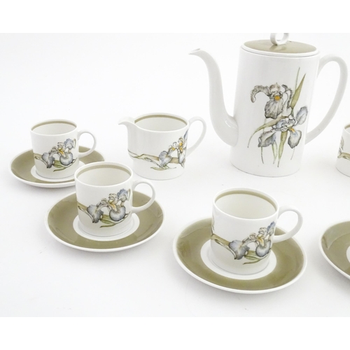 206 - A Susie Cooper coffee set decorated in the Iris pattern comprising coffee pot, sugar bowl, milk jug,... 