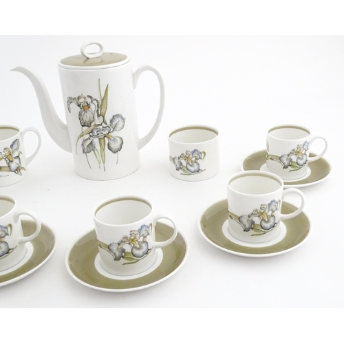 206 - A Susie Cooper coffee set decorated in the Iris pattern comprising coffee pot, sugar bowl, milk jug,... 