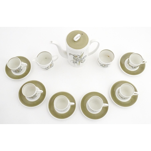 206 - A Susie Cooper coffee set decorated in the Iris pattern comprising coffee pot, sugar bowl, milk jug,... 
