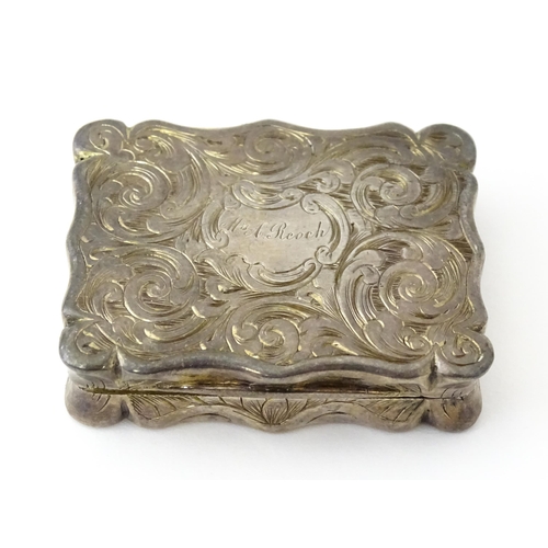 323 - A large Victorian silver vinaigrette with engraved acanthus scroll decoration, gilded interior and p... 