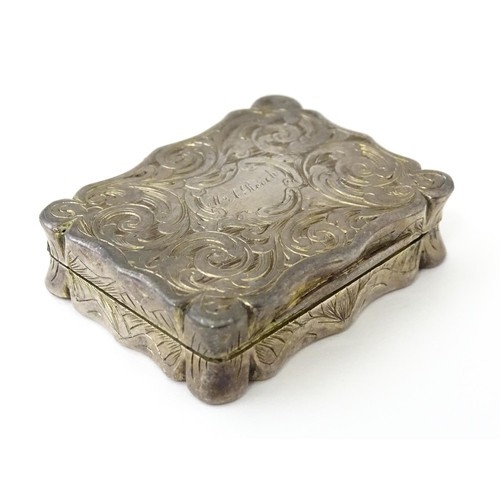 323 - A large Victorian silver vinaigrette with engraved acanthus scroll decoration, gilded interior and p... 