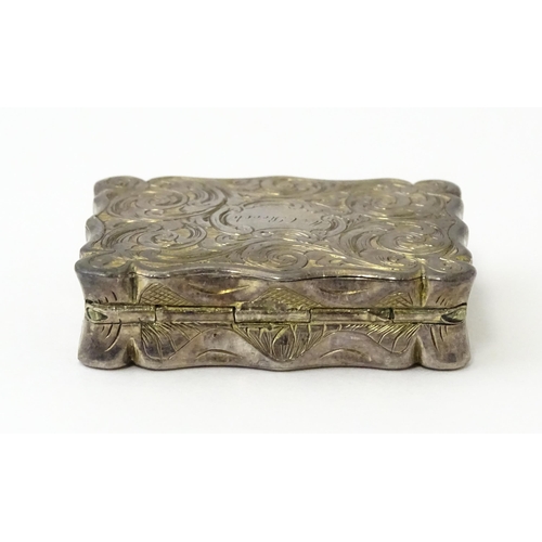 323 - A large Victorian silver vinaigrette with engraved acanthus scroll decoration, gilded interior and p... 