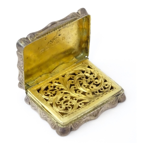 323 - A large Victorian silver vinaigrette with engraved acanthus scroll decoration, gilded interior and p... 