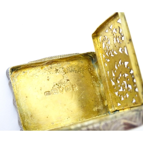 323 - A large Victorian silver vinaigrette with engraved acanthus scroll decoration, gilded interior and p... 