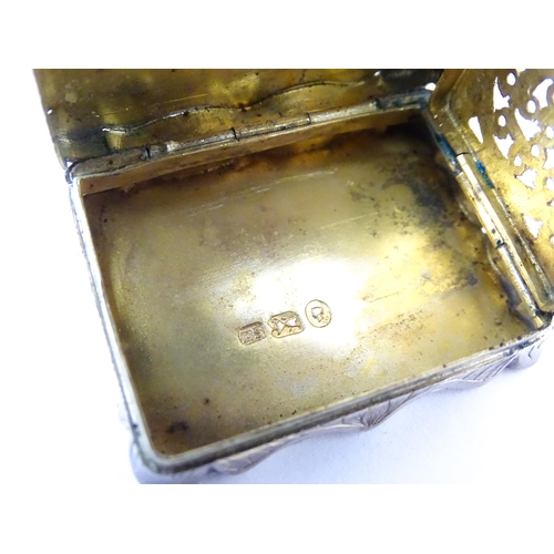 323 - A large Victorian silver vinaigrette with engraved acanthus scroll decoration, gilded interior and p... 
